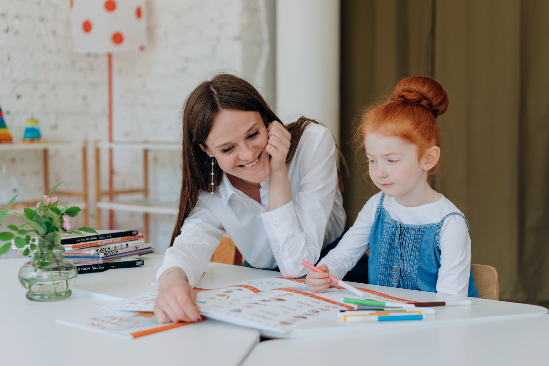 mother helping daughter with her homework