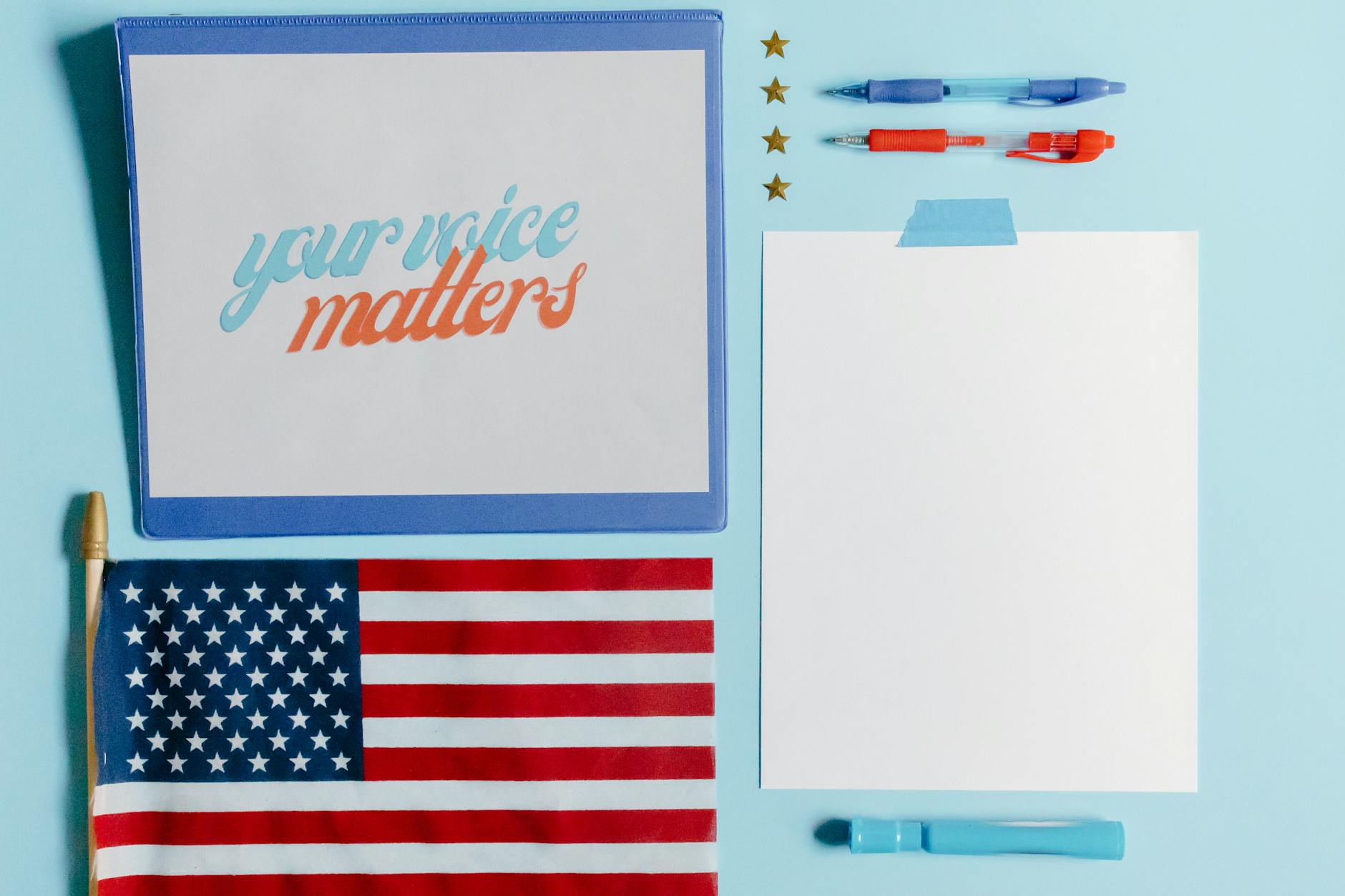 your voice matters phrase by american flag and blank page